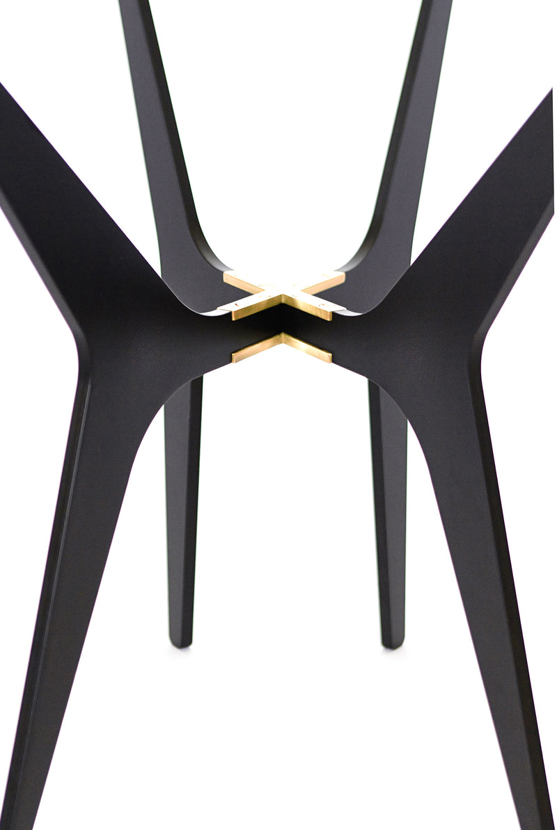 The luxurious Dean Oval Side Table is inspired by mid-century modern design but with a minimalist metallic structure softened by the rounded edges of the sleek glass top.