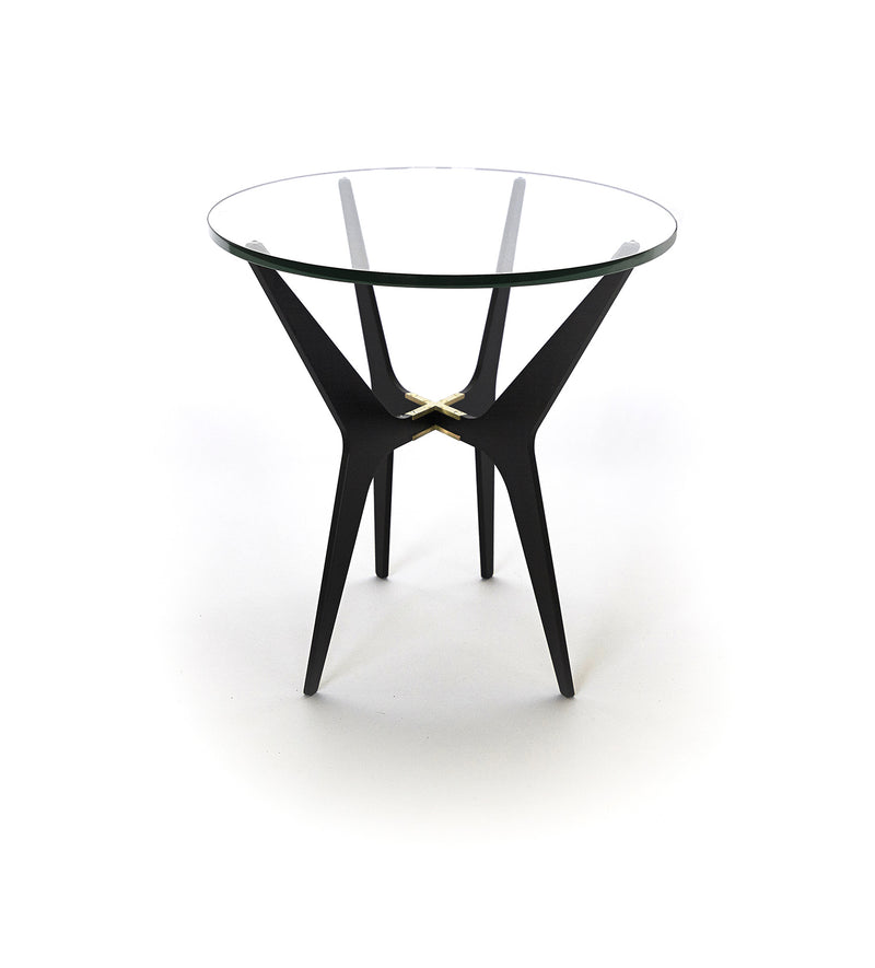 The luxurious Dean Oval Side Table is inspired by mid-century modern design but with a minimalist metallic structure softened by the rounded edges of the sleek glass top.