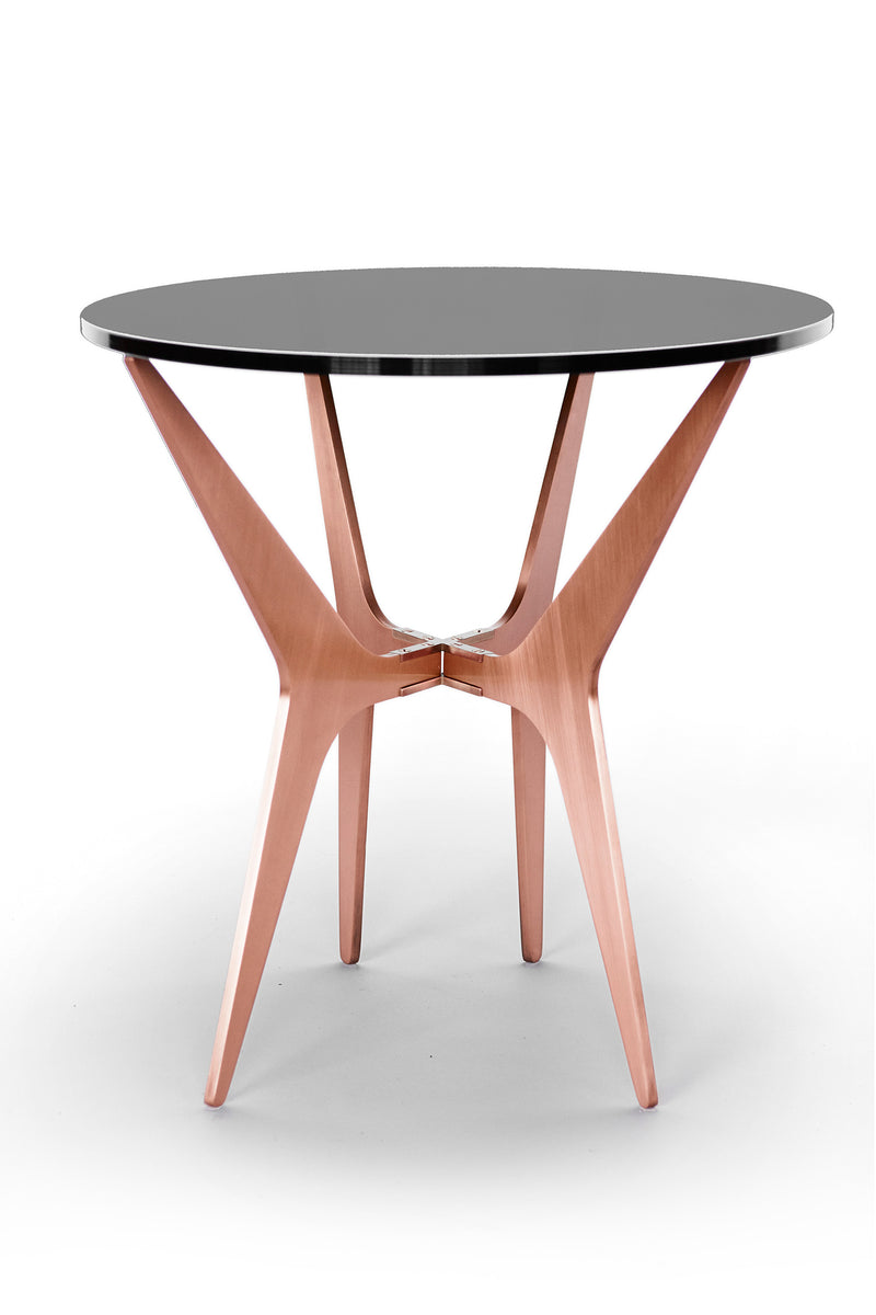 The luxurious Dean Oval Side Table is inspired by mid-century modern design but with a minimalist metallic structure softened by the rounded edges of the sleek glass top.