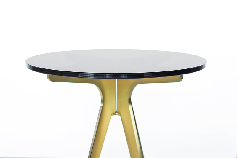 A design with mid-century sensibilities, meet the DEAN Round Side table. The coolness of a minimalist metallic structure softened by the rounded edges of its glass top, the DEAN features a versatile silhouette that breathes space into any room.