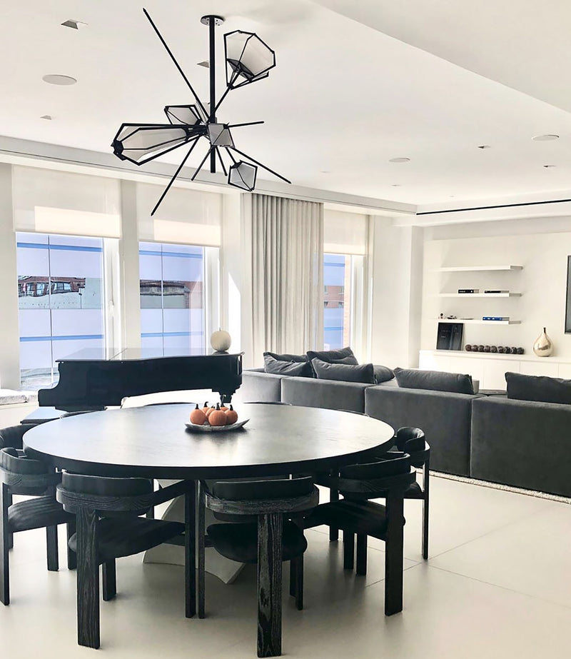 A veritable showstopper, the Harlow Large Chandelier offers luxury in an elegant starburst of light that reflects and refracts through its mold-blown glass shade. Not only designed as a contemporary steel chandelier this made-to-order lighting fixture is also available in bronze, copper, nickel and brass.