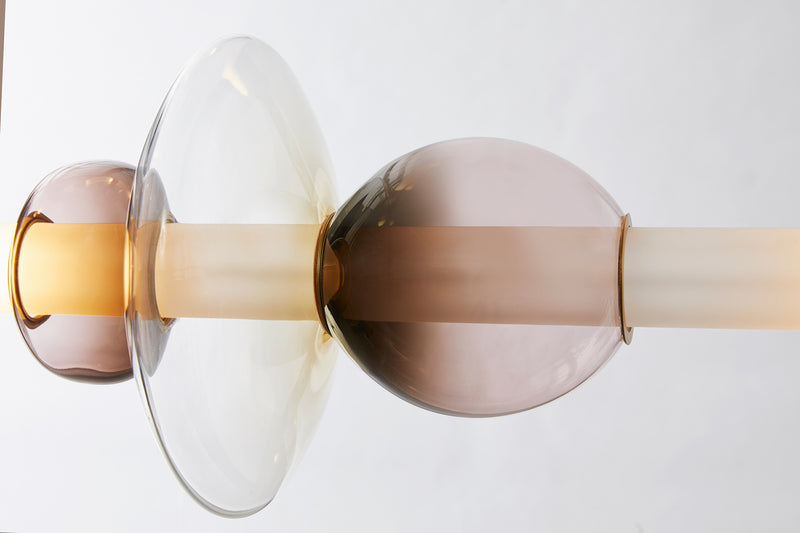 The Luna Chandelier 2-tier is a modern glass chandelier and a perfect statement piece for anywhere within the home or hospitality space. An opportunity to create a unique and enticing lighting solution, as it encompasses a modular design format, this light is customisable to your choices to create a bespoke chandelier.