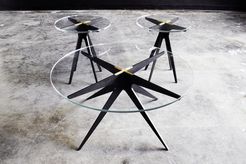 Bring mid-century style home with the Dean coffee table from Gabriel Scott. Industrial in design with elegant lines, it features a sleek, rounded glass tabletop with the brand’s signature black and brass finishes.