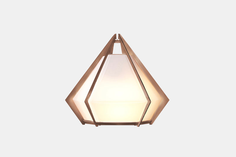 The Harlow wall sconce is an elegant sculptural handmade light fixture inspired by jewelry design featuring a mold-blown glass gem in a chic metallic setting. Created by contemporary designer, Gabriel Scott, the Harlow wall sconce is luxury wall lighting for both bedroom and living room.