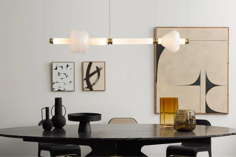 Showcasing contemporary industrial design met with elegant lines, the DEAN Dining Table features Italian and Turkish marbles set atop its layered metallic legs.