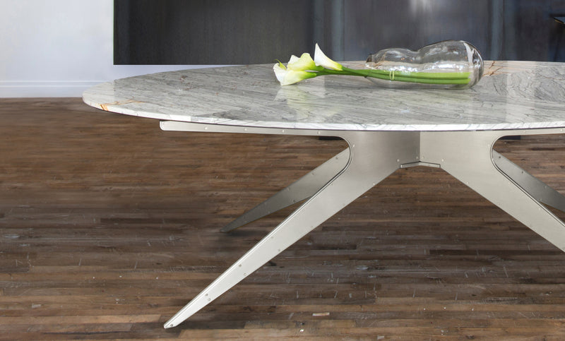Showcasing contemporary industrial design met with elegant lines, the DEAN Dining Table features Italian and Turkish marbles set atop its layered metallic legs.