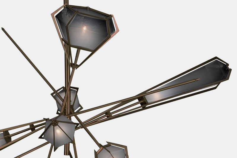 The Harlow Chandelier is directly inspired by the world of jewelry with its metallic frame encasing a translucent glass adding a touch of glamor to any residential or hospitality space.