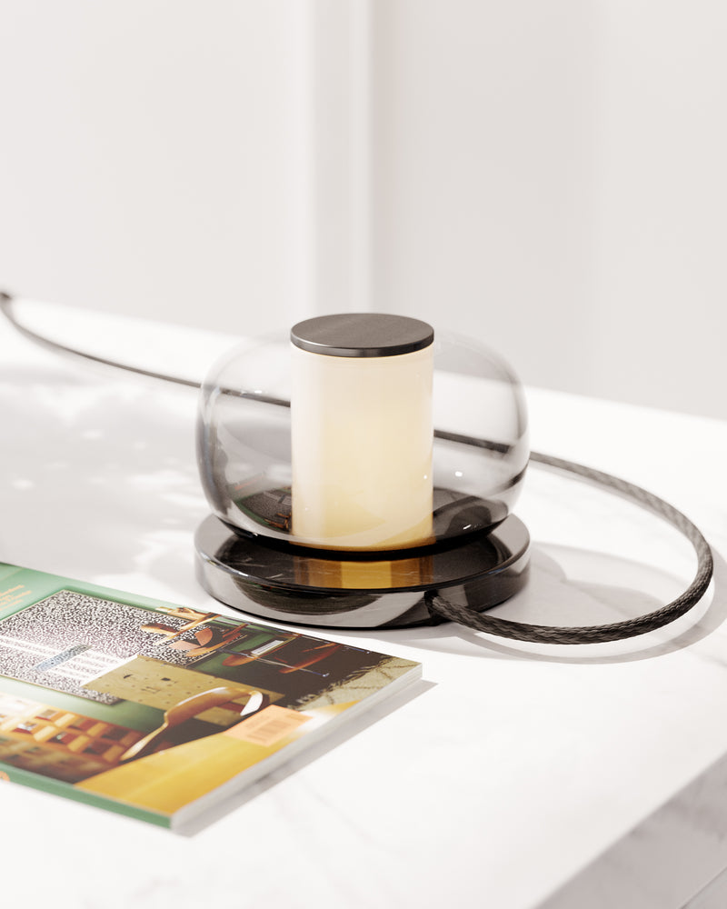 A high end desk lamp created with a sophisticated mix of glass and stone, the Luna A desk lamp stands out by the softness of its shapes and lines and is controlled by an elegant inline dimmer. The Luna A desk lamp by contemporary designer, Gabriel Scott, is the perfect desk lamp for a high end private office.