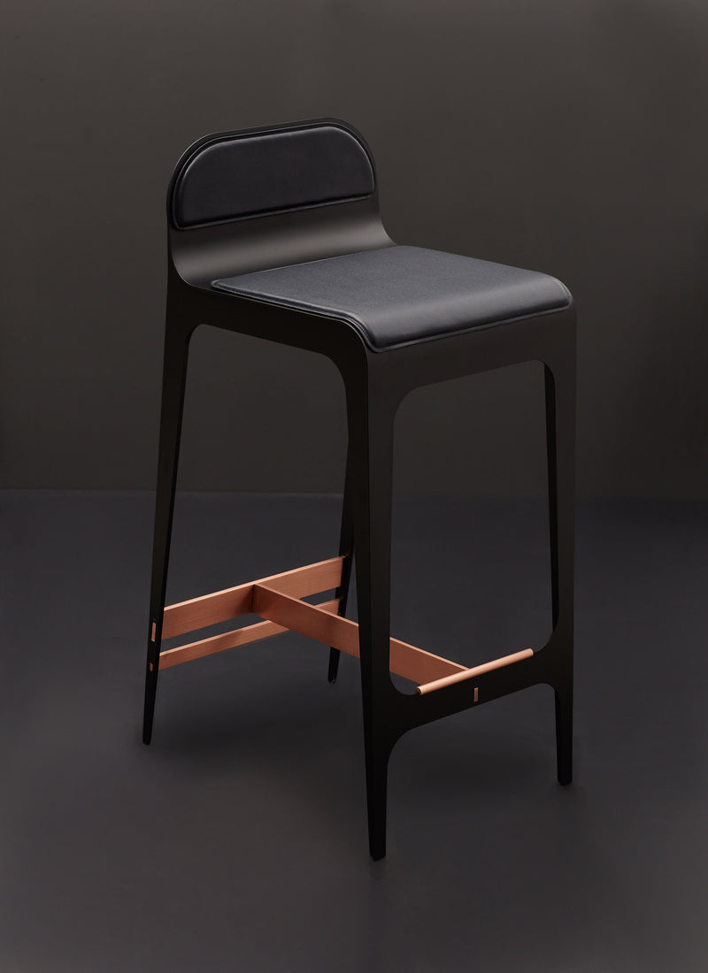 The Bardot Counterstool is finished with a vegan leather seat and metal hardware and designed by Gabriel Scott for sitting at counter top level.