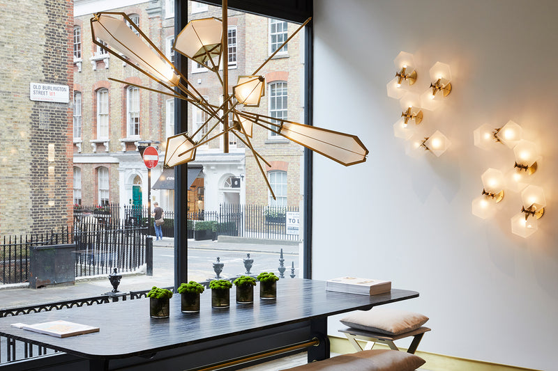 A veritable showstopper, the Harlow Large Chandelier offers luxury in an elegant starburst of light that reflects and refracts through its mold-blown glass shade. Not only designed as a contemporary steel chandelier this made-to-order lighting fixture is also available in bronze, copper, nickel and brass.
