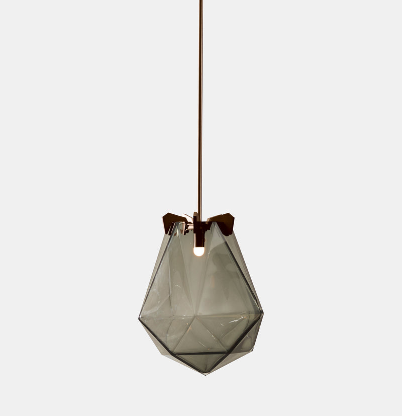 A powerful warm light diffused through double-blown glass, the BRIOLETTE showcases striking prismatic contours held by metallic prongs. This handmade glass pendant lighting by contemporary lighting designer, Gabriel Scott is a perfect addition to modern interior design.
