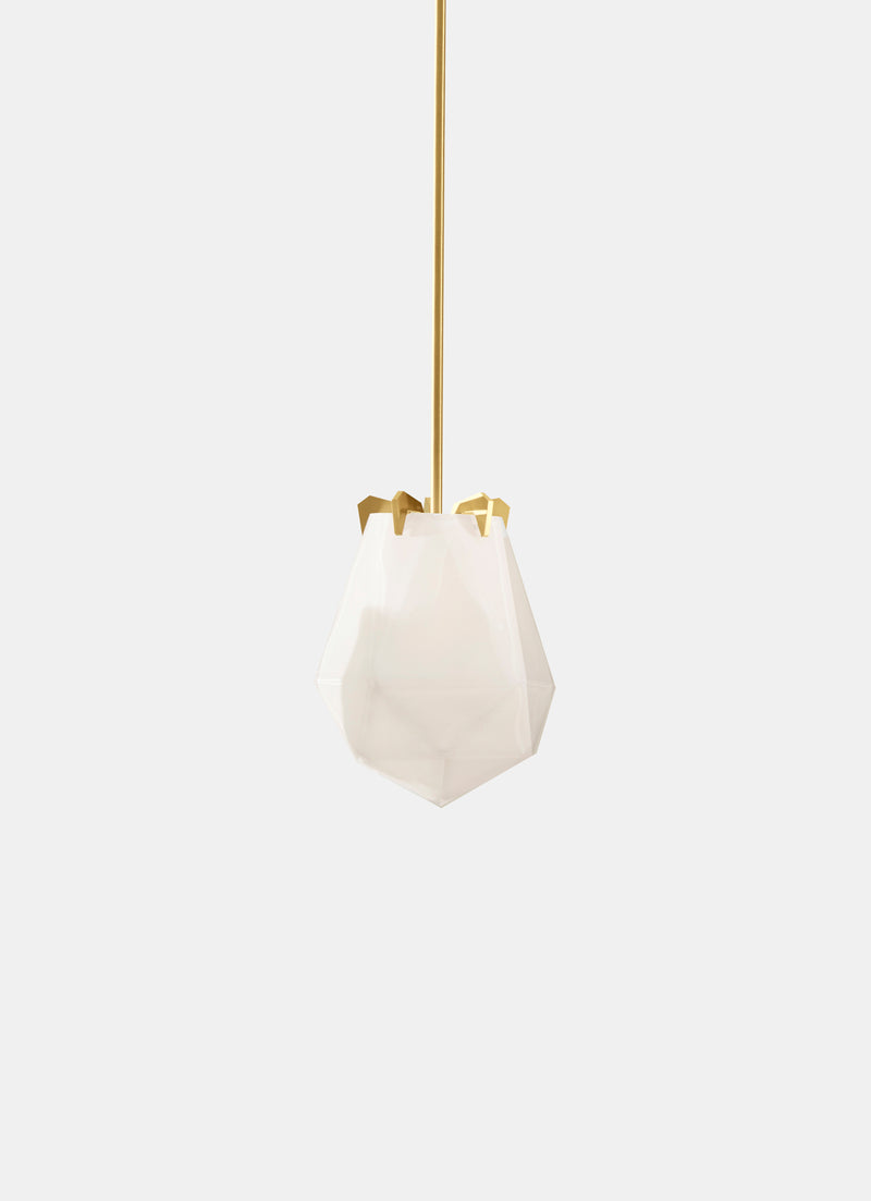 A powerful warm light diffused through double-blown glass, the Briolette Small Pendant showcases striking prismatic contours held by the brand’s signature metallic prongs.