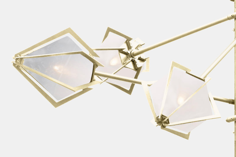 Inspired by jewelry design, the made to order Harlow Spoke Chandelier elevates any room with a touch of glamor through its mold-blown glass shades and metallic frames. This bespoke pendant lighting is a handmade glass chandelier for luxury interior design.