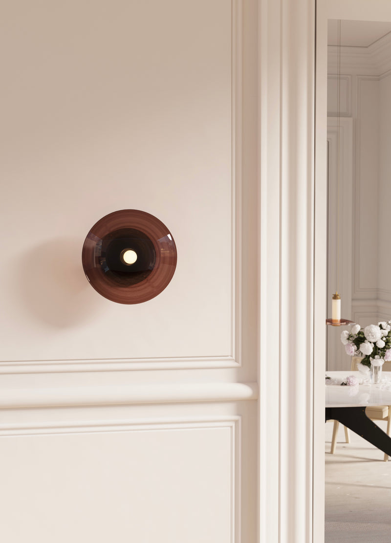 The softness and uniqueness of the Luna A Round Sconce makes this piece perfect for all applications. This contemporary round wall sconce available in smoked or bronze glass suitable to elevate any interior project.