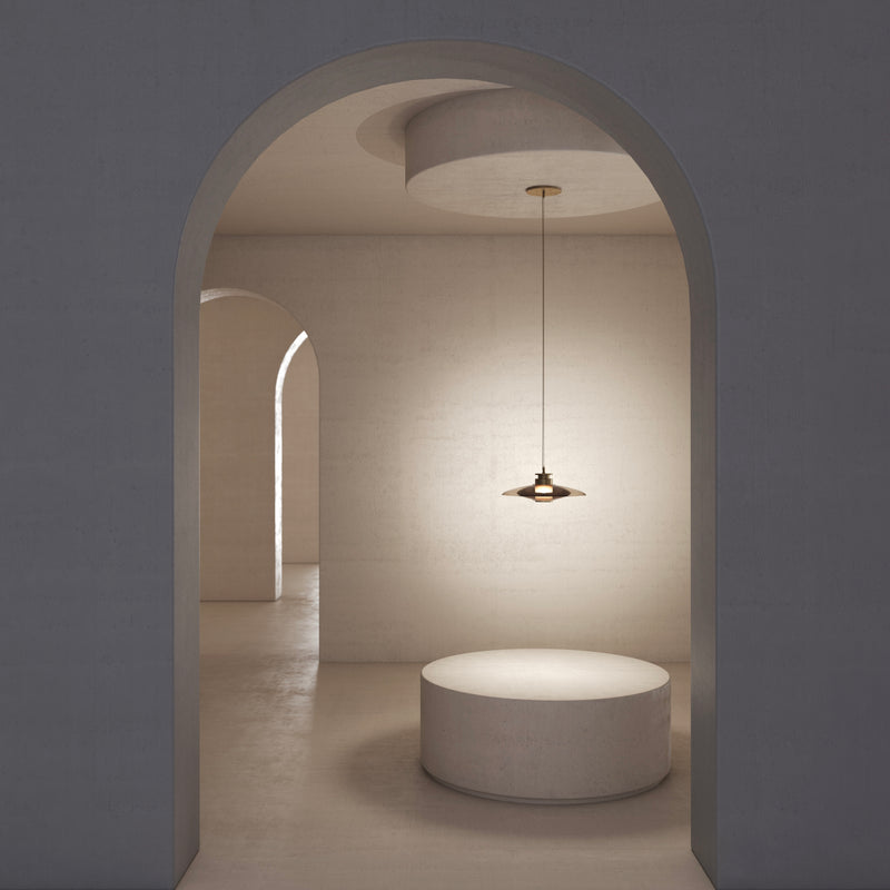 A soft interplay between full and half-full shapes, the Luna A Disc Pendant, by contemporary lighting designer, Gabriel Scott, brings out the elegance of the glass assembly. This handmade, made to order, modern, designer light will look good in your dining or living room or kitchen.