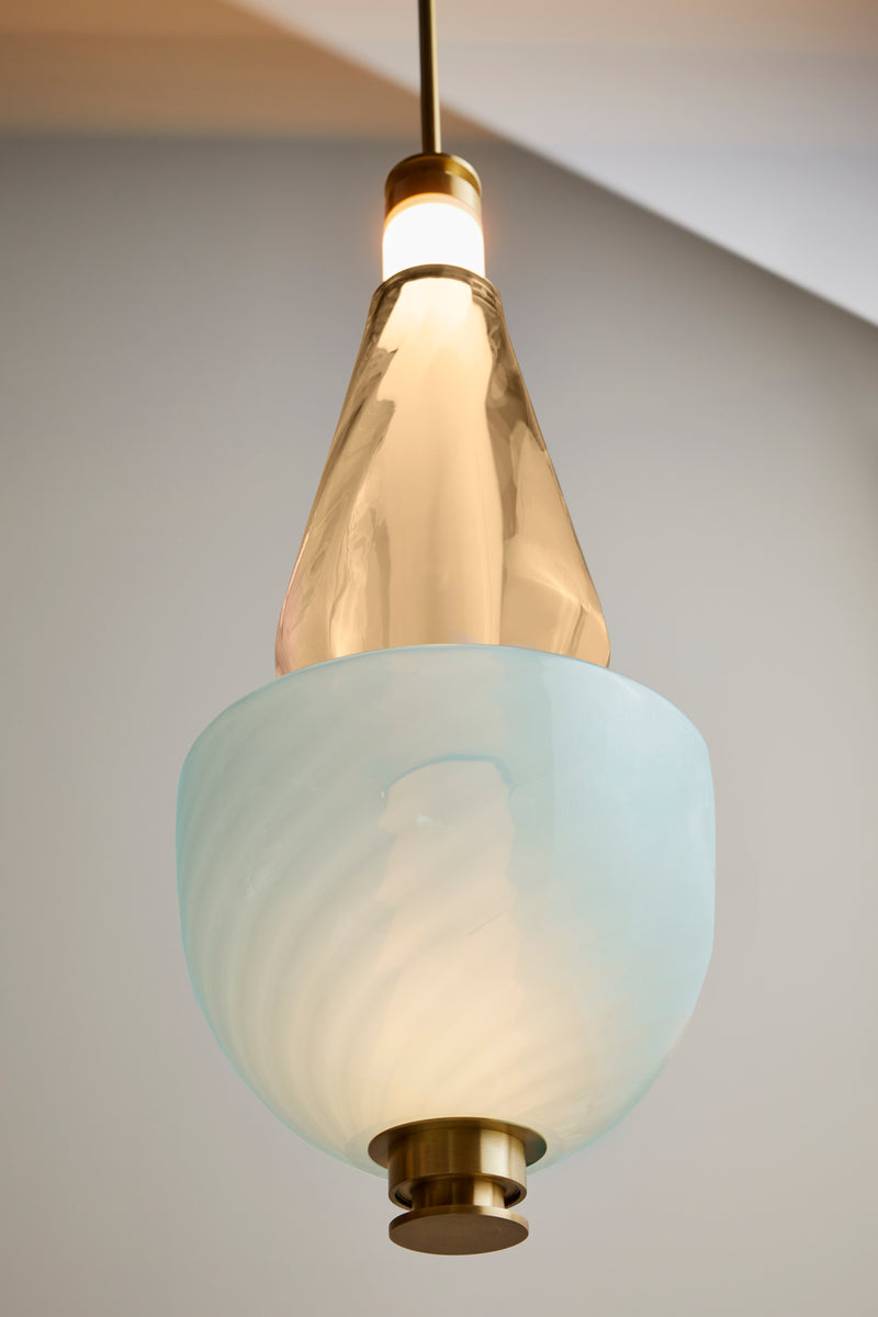 Contemporary lighting designer, Gabriel Scott, takes inspiration from a lunar halo, the Luna Kaleido Large Pendant is a highly customizable modular light fixture which features two textured glass beads covering a white glass tube. This glass pendant lighting provides a luxury lighting fixture solution for high end interior design.